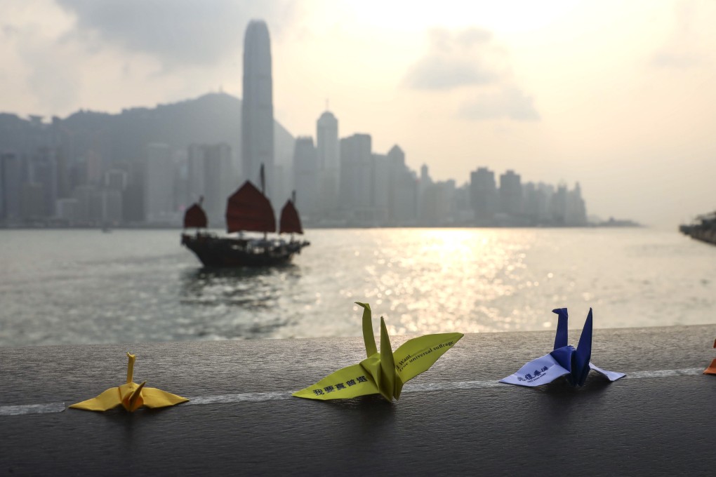 Anti-government protesters place paper cranes along the Avenue of Stars at Victoria Harbour in Tsim Sha Tsui. Four months of demonstrations have taken a toll on business sentiment. Photo: K.Y. Cheng