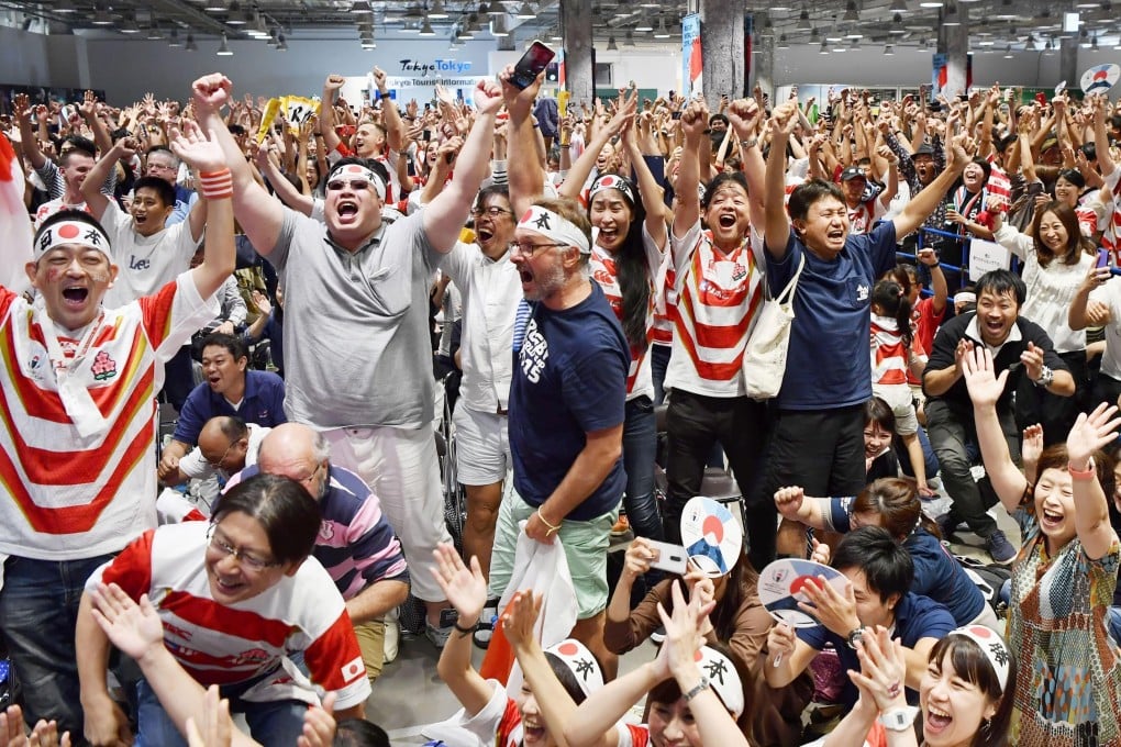 Japan fans celebrate the team’s win over Scotland at the Rugby World Cup. Photo: AP