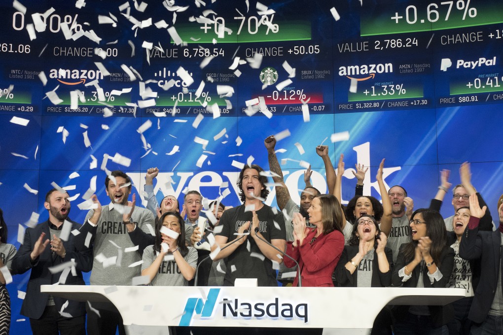 Adam Neumann (centre), co-founder and CEO of WeWork, at the opening bell ceremony at Nasdaq in New York on January 16, 2018. Photo: AP