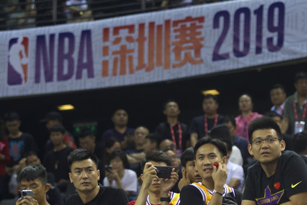 Basketball fans attend a match between the NBA’s Brooklyn Nets and Los Angeles Lakers at Shenzhen, in the southern Chinese province of Guangdong on Saturday. Photo: AP