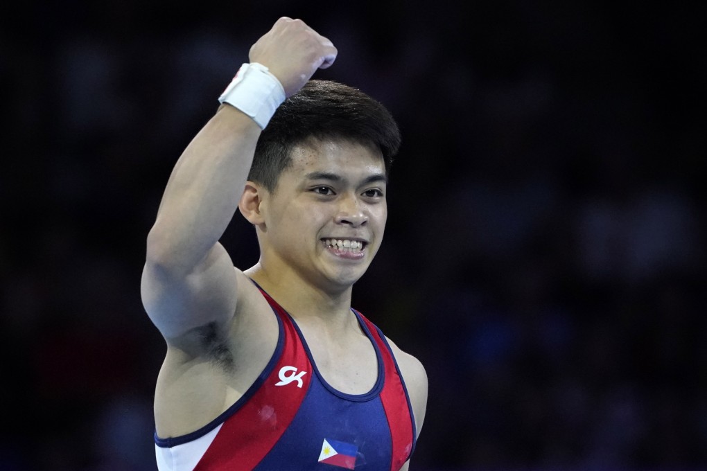 The Philippines’ Carlos Yulo punches the air after his gold-winning routine in the men’s floor exercise at the world championships. Photo: EPA