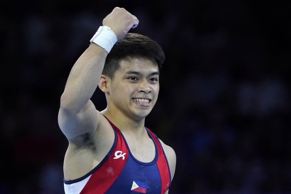 The Philippines’ Carlos Yulo punches the air after his gold-winning routine in the men’s floor exercise at the world championships. Photo: EPA