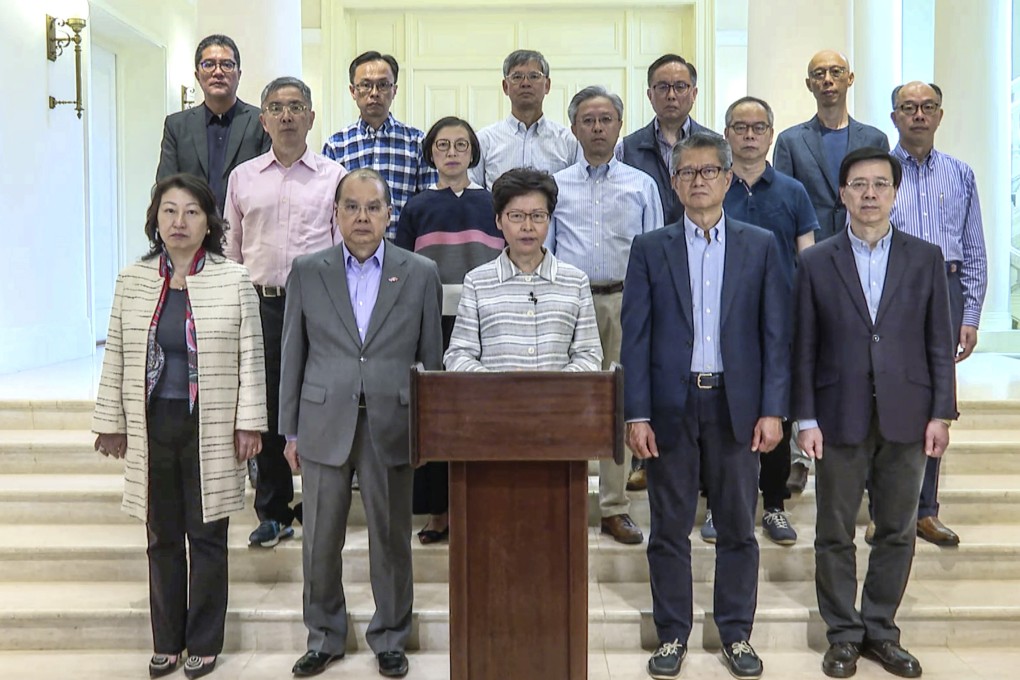 Hong Kong Chief Executive Carrie Lam, flanked by members of her cabinet, calls on the public to condemn violence and disassociate with rioters, on October 5. Photo: Handout