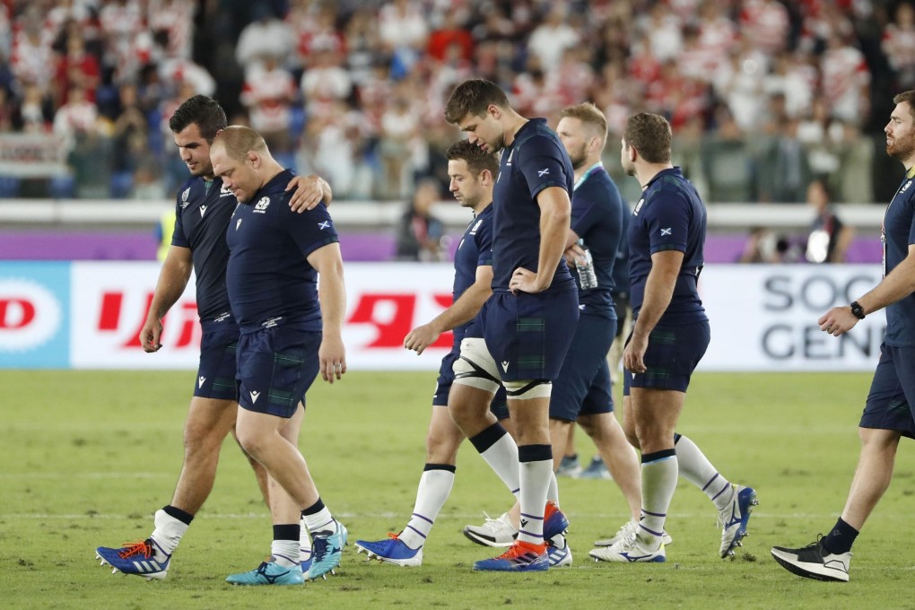 Scotland players look dejected after being defeated by Japan in the Rugby World Cup. Photo: Kyodo