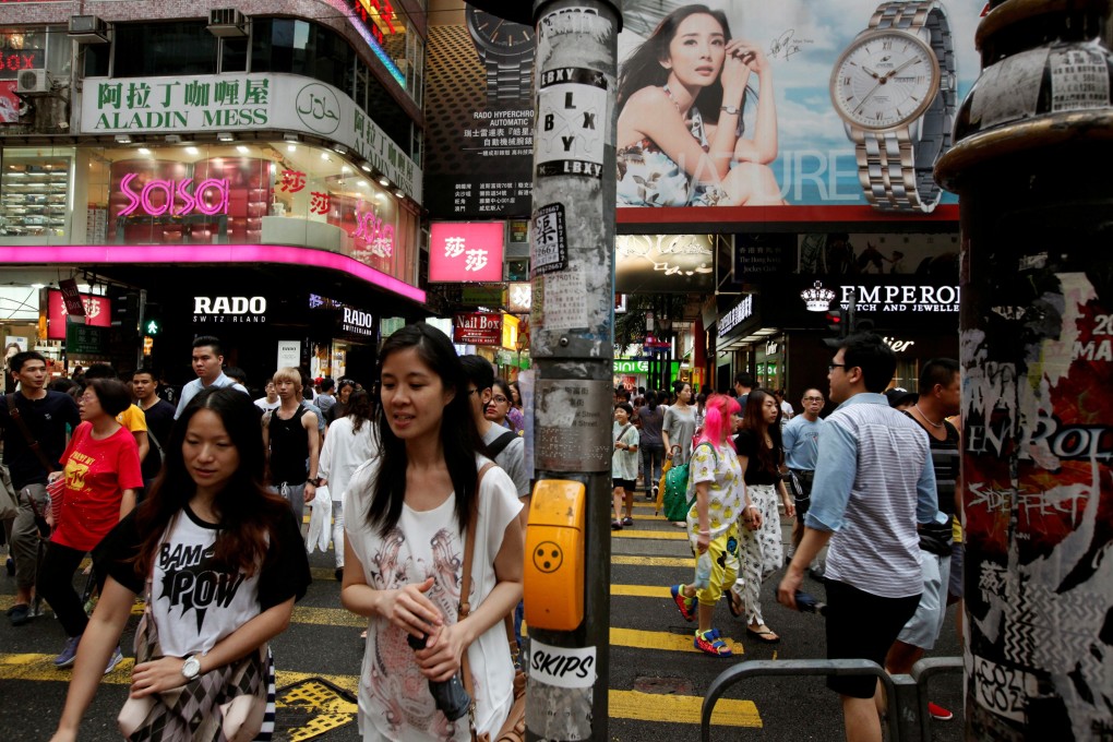 Shoppers at the Causeway Bay shopping district in Hong Kong on July 22, 2014. Photo: Reuters