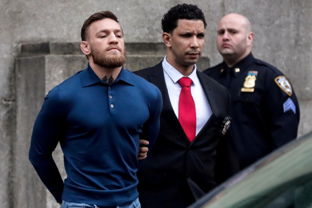 Conor McGregor walks out of the 78th police precinct after charges were laid against him in the Brooklyn borough of New York City in April 2018. Photo: Reuters