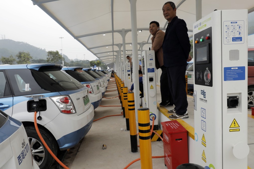 A fleet of new electric-powered taxis are charged at a public charging station in the hi-tech hub of Shenzhen, in southern China's Guangdong province, on January 7. Photo: AP