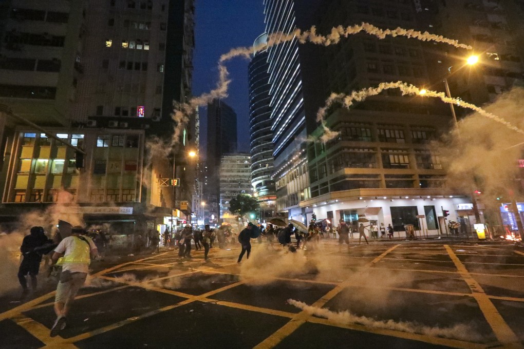 Riot police respond with tear gas as protesters throw petrol bombs and set objects on fire during scuffles with police at the junction of Fleming Road, and Hennessy Road following an anti-extradition bill march from Causeway Bay towards Wan Chai and Admiralty on 29 September 2019. Photo: Felix Wong