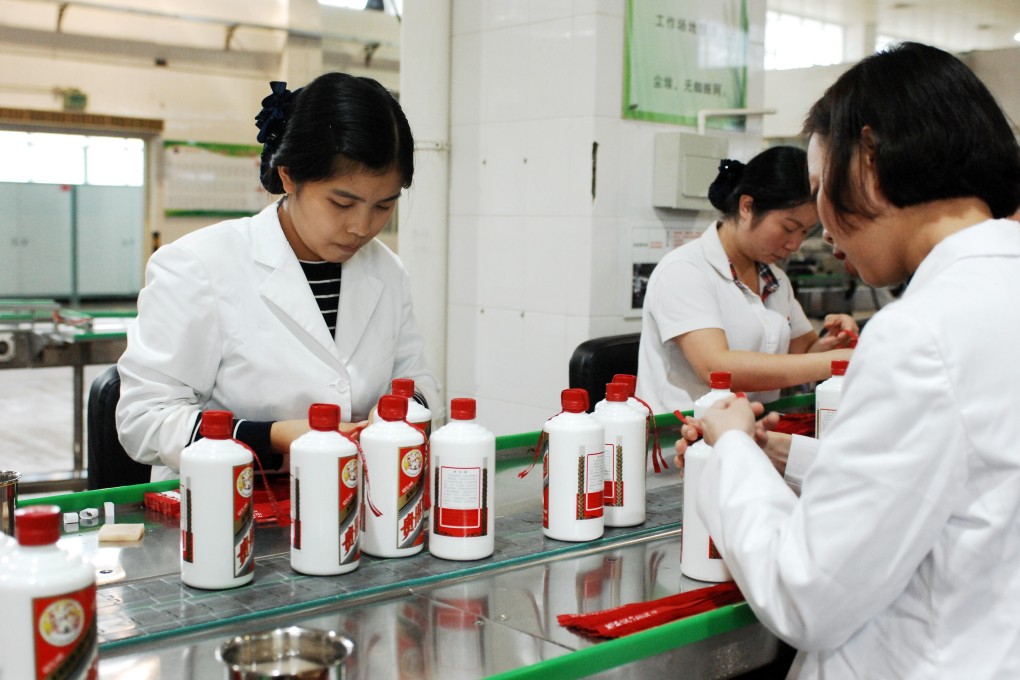 Workers pack bottles of Kweichow Moutai liquor in Renhuai, in the southwest Chinese province of Guizhou. Photo: Xinhua