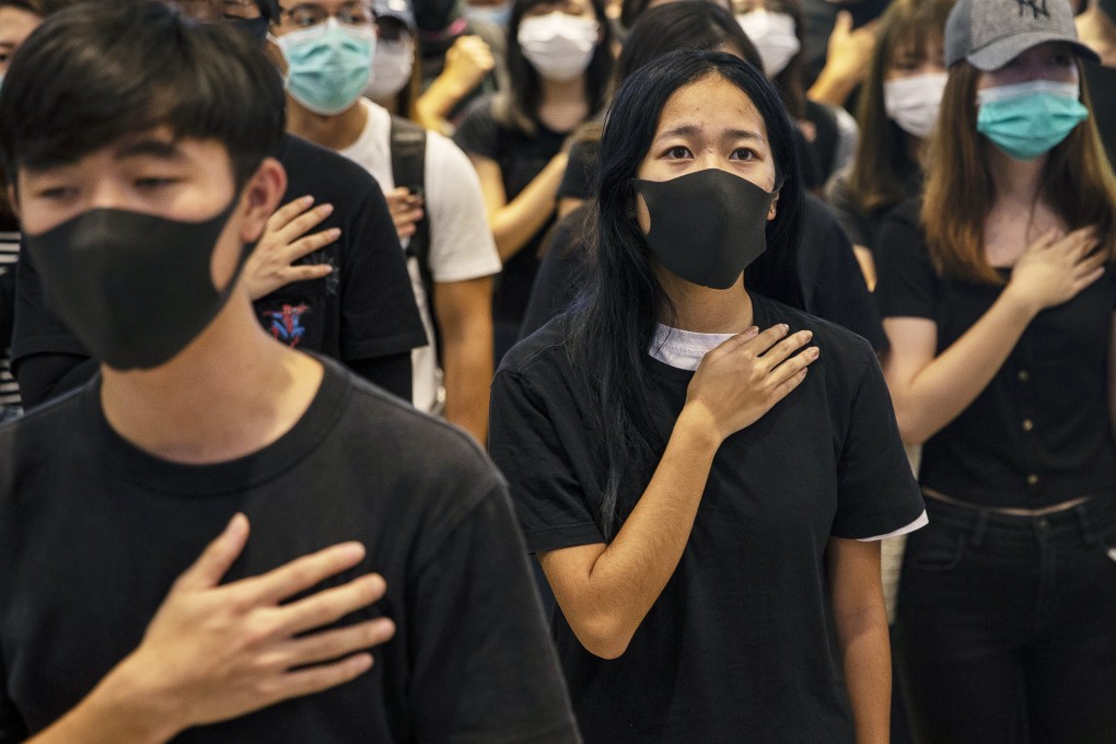 Hong Kong protesters in their “uniform” of black T-shirts at a shopping mall in Yuen Long district. Chinese customs authorities have banned the shipping of black clothing to Hong Kong. Photo: EPA-EFE