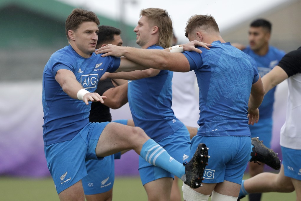 New Zealand’s Beauden Barrett (left) and teammate Sam Cane stretch during a training session in Tokyo. Photo: AP