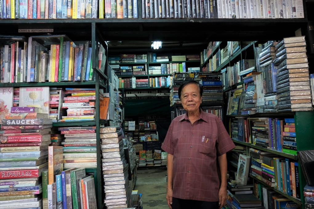 The “godfather of the second-hand book industry” Dilok Suengsoonthorn, the Thai-Chinese owner of Dilok Book at the Chatuchak Weekend Market in Bangkok, Thailand. Photo: Tibor Krausz