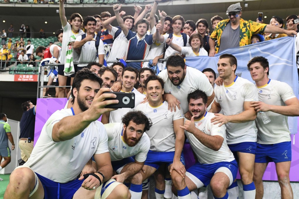Uruguay players takes a selfie after losing to Australia at the Rugby World Cup. Photo: Kyodo