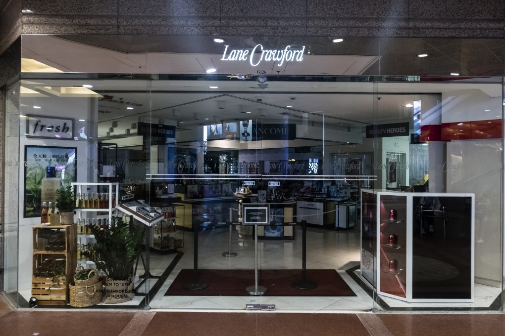A sign informing customers that the store is closed stands at an entrance to Lane Crawford’s store in Times Square, Causeway Bay, during an anti-government protest at the mall. Photo: Bloomberg