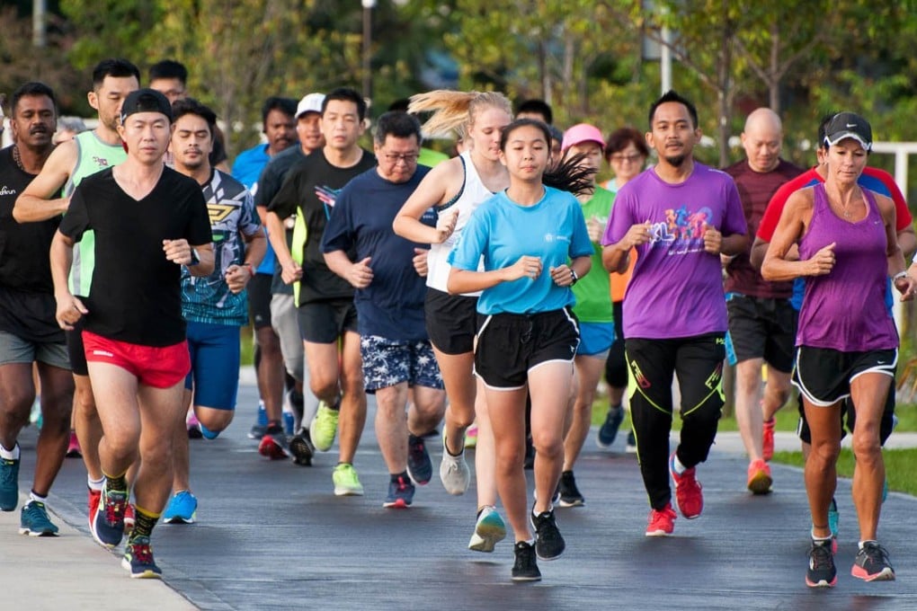 Runners taking part in the Taman Pudu Ulu Parkrun in Kuala Lumpur, Malaysia. The 5km running event has become a global phenomenon. Photo: Parkrun