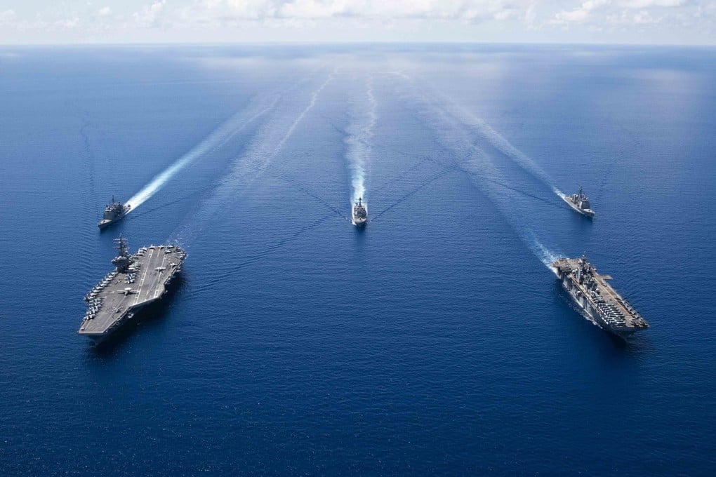 US Navy ships from Ronald Reagan Carrier Strike Group and Boxer Amphibious Ready Group sailing in formation in the South China Sea. Photo: EPA