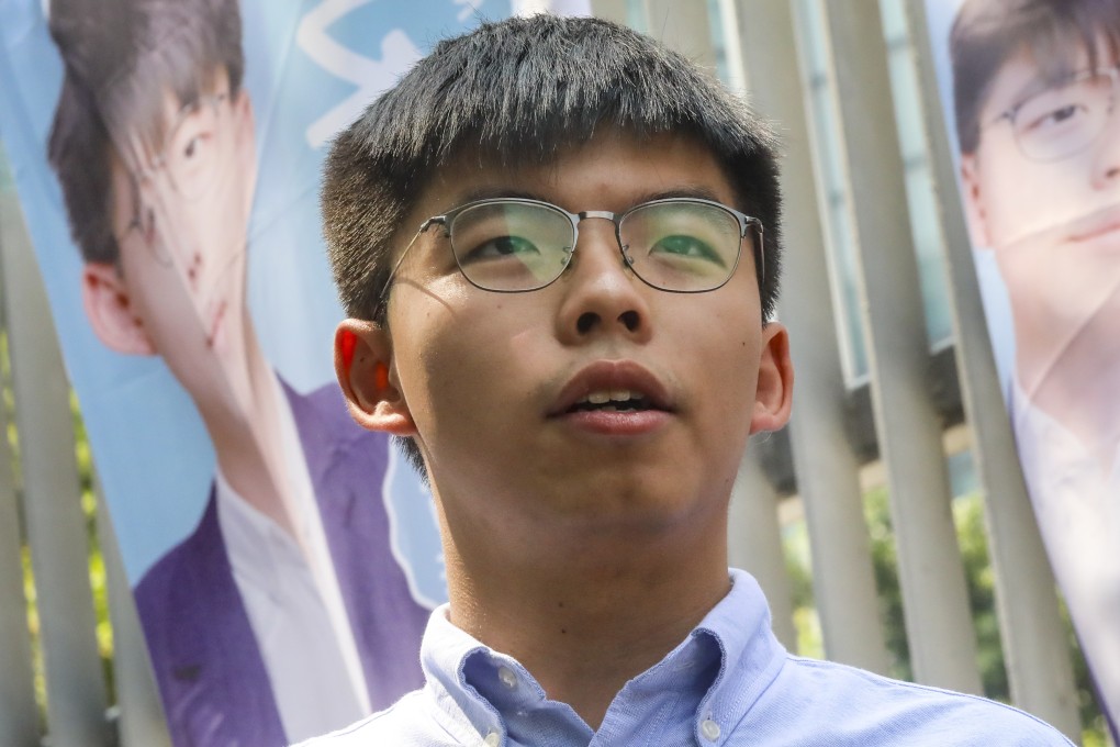 Pro-democracy activist Joshua Wong, who has received a letter from returning officers seeking explanation of his stance, says he will not let his rival win uncontested. Photo: K.Y. Cheng
