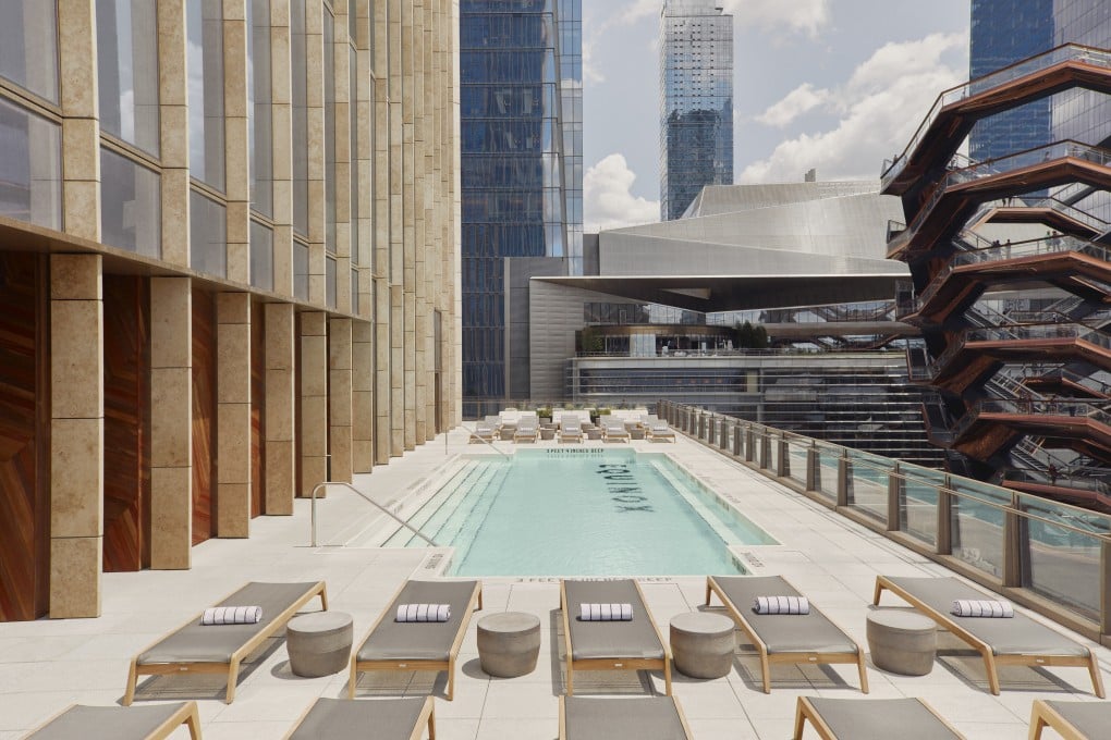 The outdoor ‘leisure pool’ at New York City’s Equinox Hotel offers skyline views of Manhattan.