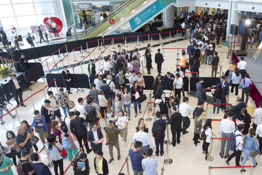 Prospective buyers queue up to buy flats at CK Asset’s Seaside Sonata residential project in Sham Shui Po, on Thursday. Photo: Handout.
