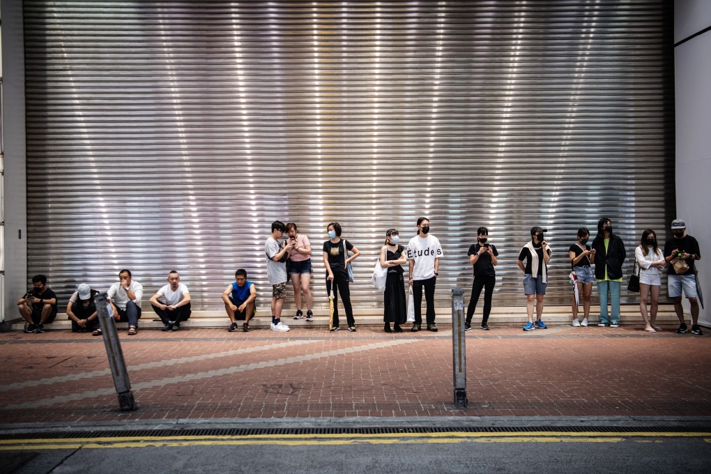 Demonstrators stand in front of a shuttered mall in the Causeway Bay district of Hong Kong on October 7. Short-term harm inflicted by the protests is already severe, and is likely to get worse before recovery becomes possible. Photo: Bloomberg