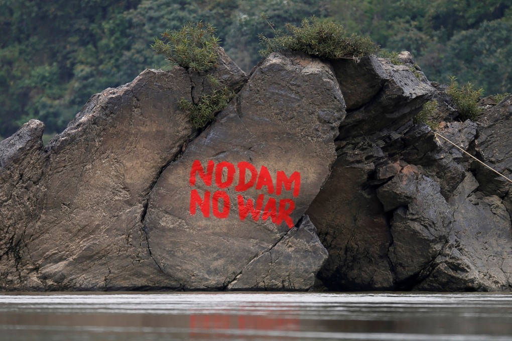 Graffiti on a stone at Myitsone. Photo: Reuters