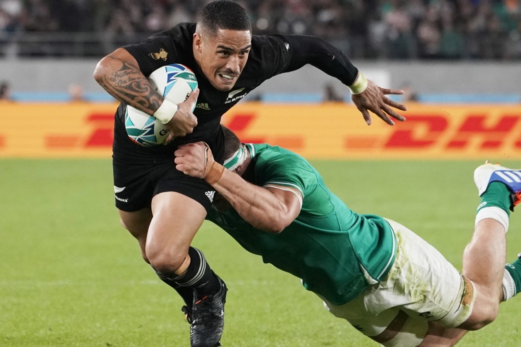 New Zealand's Aaron Smith is tackled by Ireland's Iain Henderson during the Rugby World Cup quarter-final in Tokyo Stadium. Photo: EPA