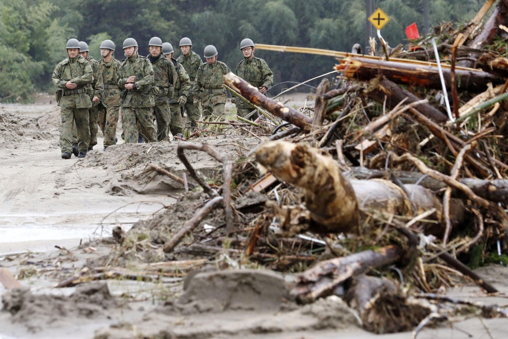 Soldiers inspect the extent of damage in Marumori, Miyagi Prefecture, northeastern Japan, after the area was devastated by Typhoon Hagibis. Photo: Kyodo