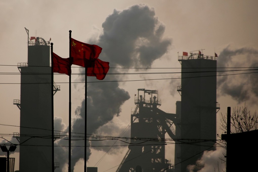FILE PHOTO: Chinese national flags flutter near a steel factory in Wu'an, Hebei province, China, February 23, 2017. REUTERS/Thomas Peter/File Photo