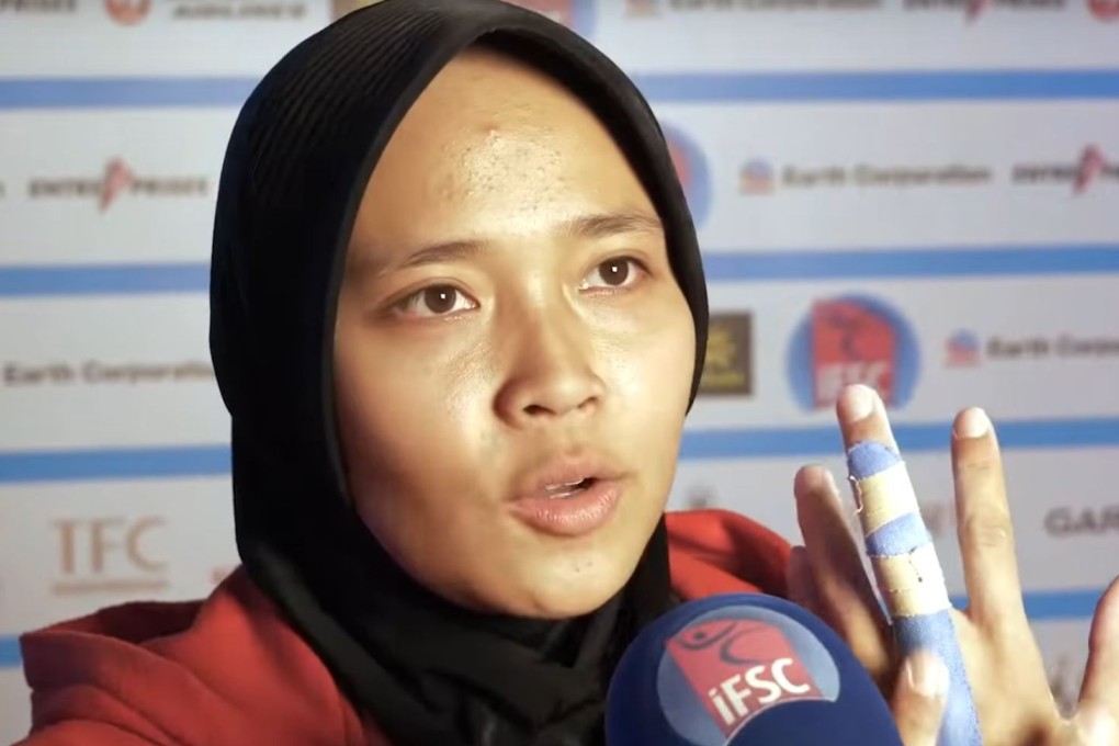 Aries Susanti Rahayu after smashing the speed climbing world record in Xiamen, China. Photo: YouTube/IFSC