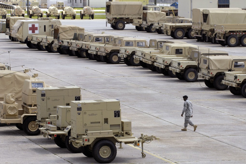 A soldier walks through the 4th Infantry Brigade Combat Team motor pool at Fort Stewart. Photo: AP Photo