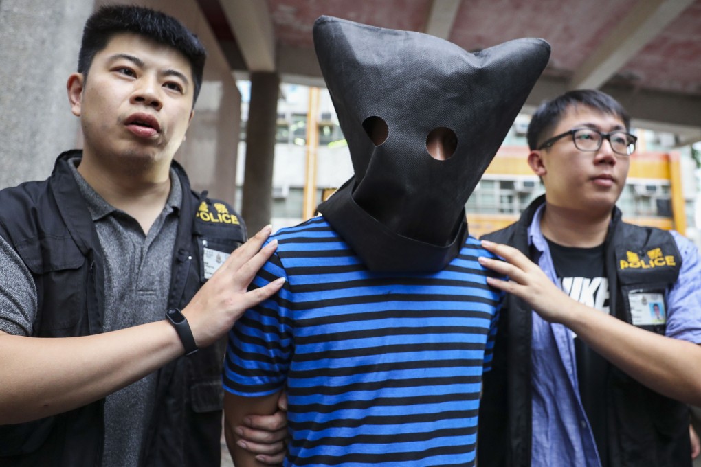 Hong Kong police arrest a man in Tsing Yi, who is thought to be responsible for the recent spate of needles sticking out of bus seats. Photo: Winson Wong