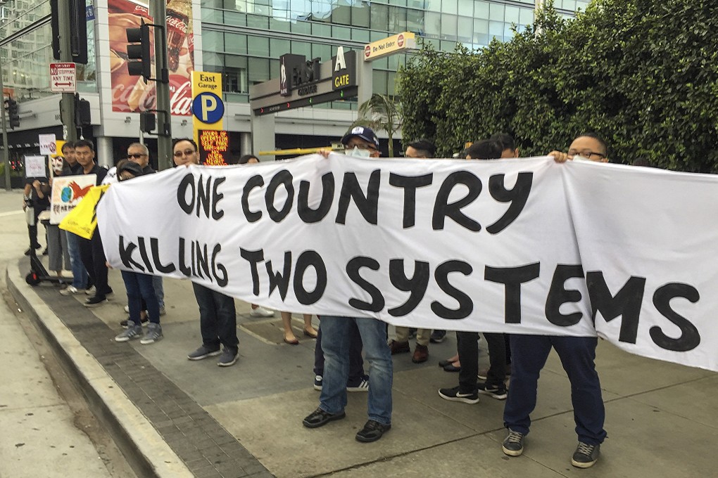 Hongkongers protesting outside the Hong Kong Trade Development Council symposium in Los Angeles, US, on September 21. “One country, two systems” does not have to die come 2047. Photo: Tony Cheung