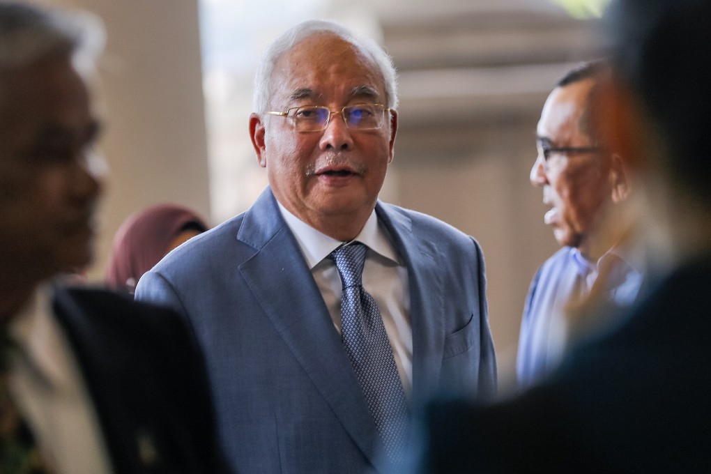 Former Malaysian Prime Minister Najib Razak, centre, at the high court in Kuala Lumpur. Photo: EPA