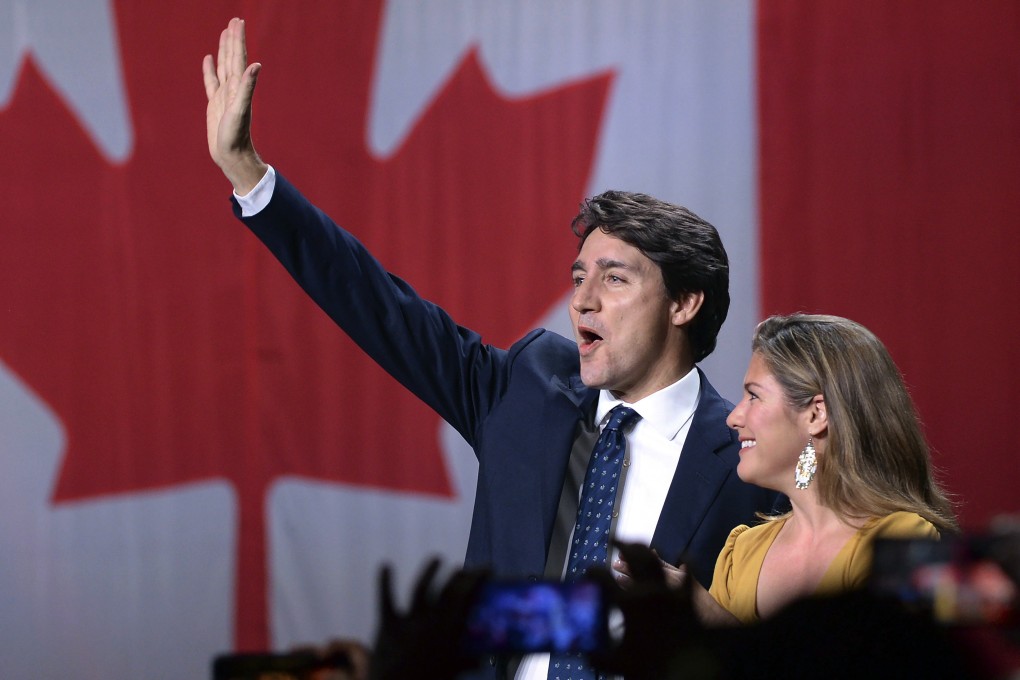 Canadian Prime Minister Justin Trudeau and his wife, Sophie Gregoire Trudeau, wave as they go on stage at Liberal election headquarters in Montreal on Monday. Photo: AP