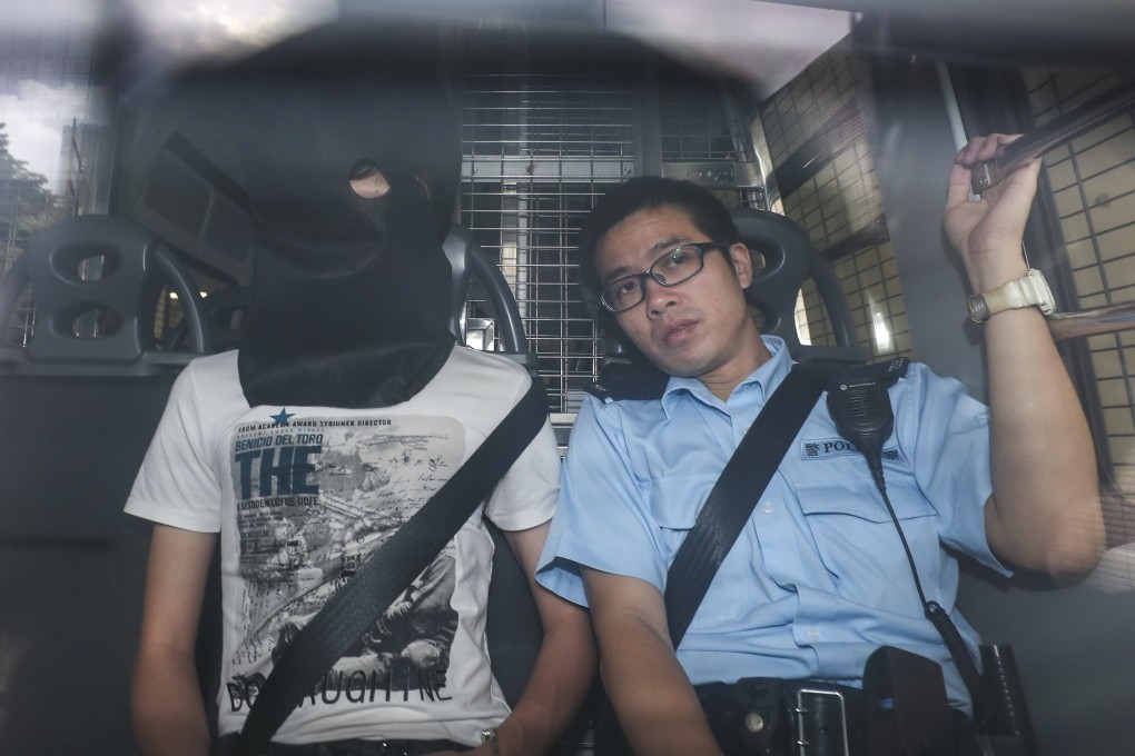 Louis Lo is escorted to West Kowloon Court on July 22 to face a charge of possessing an explosive substance. Photo: Sam Tsang