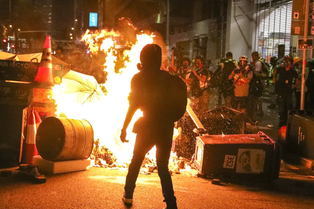 Protesters throw petrol bombs and set fires during scuffles with police in Hong Kong on September 29. There are those who profess sympathy and support for lawbreaking protesters, emboldening them. Photo: K.Y. Cheng