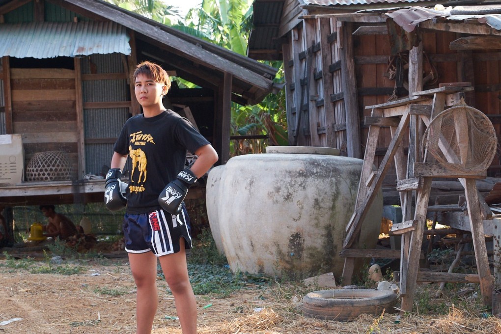 Loma Lookboonmee outside her family home in Thailand. Photo: Thanit Watthanaya