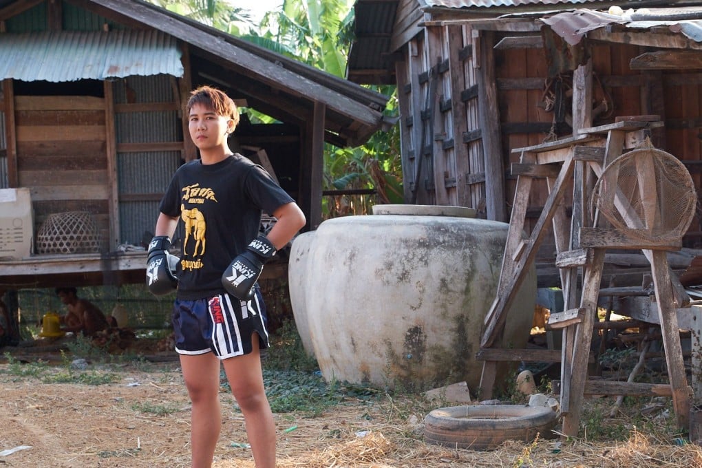 Loma Lookboonmee outside her family home in Thailand. Photo: Thanit Watthanaya