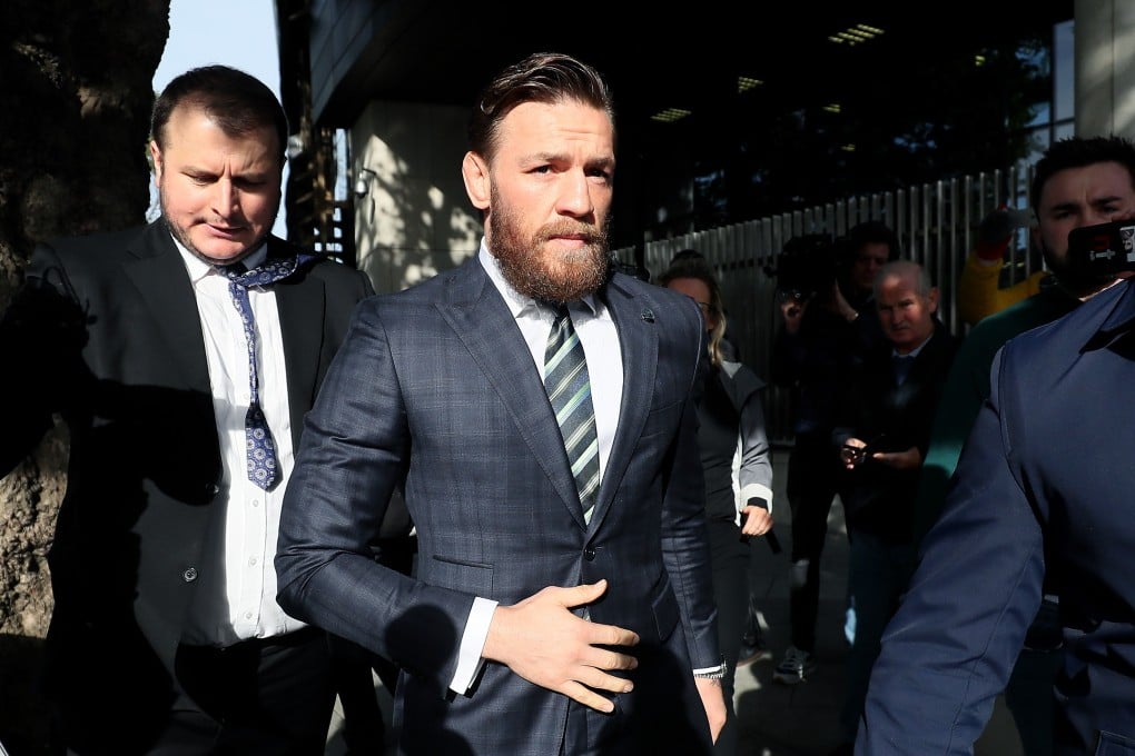 UFC fighter Conor McGregor leaves the Criminal Courts of Justice where he is appearing on an assault charge after allegedly punching a man at the Marble Arch pub in Drimnagh on April 6 while promoting his brand of whisky. Photos: DPA