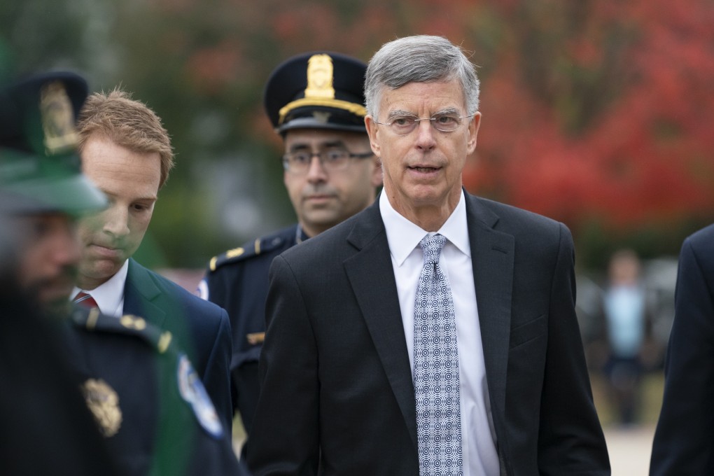 Ambassador William Taylor is escorted by US Capitol Police as he arrives to testify before House committees as part of the impeachment investigation of President Donald Trump in Washington on Tuesday. Photo: AP