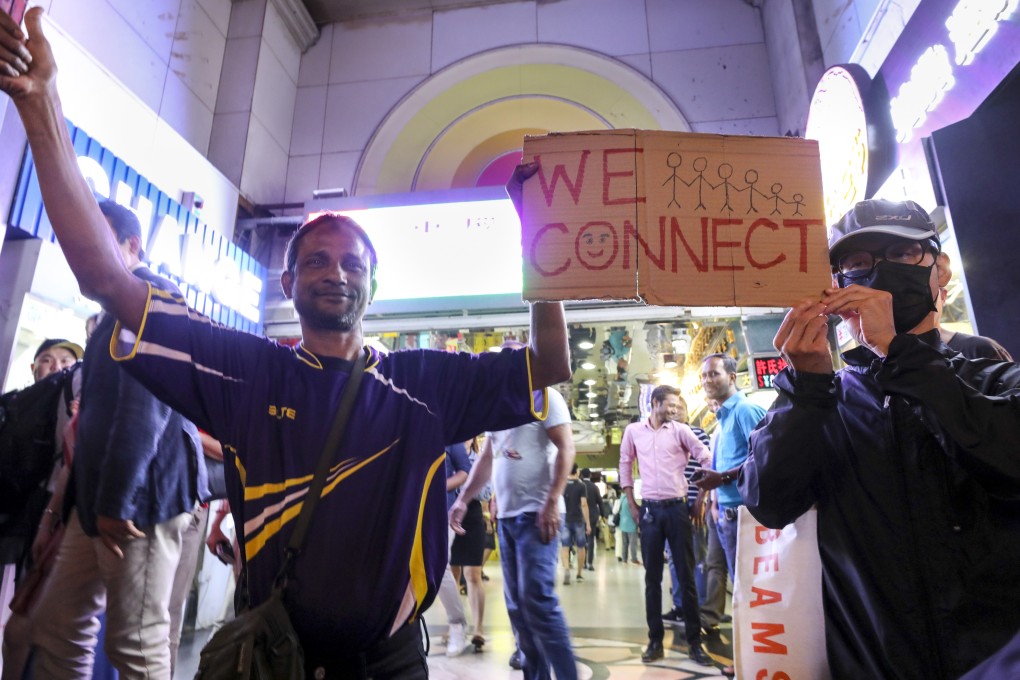 Anti-government protesters during a singalong protest in solidarity with the local ethnic minority community at Chungking Mansions, Tsim Sha Tsui. Photo: Dickson Lee