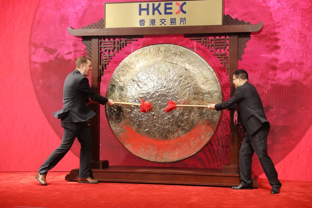 Budweiser Brewing Company APAC Limited’s chief executive officer Jan Craps (left) and the company’s executive director Frank Wang striking a ceremonial gong during the September 30 listing ceremony at the Hong Kong Stock Exchange. Photo: Bloomberg