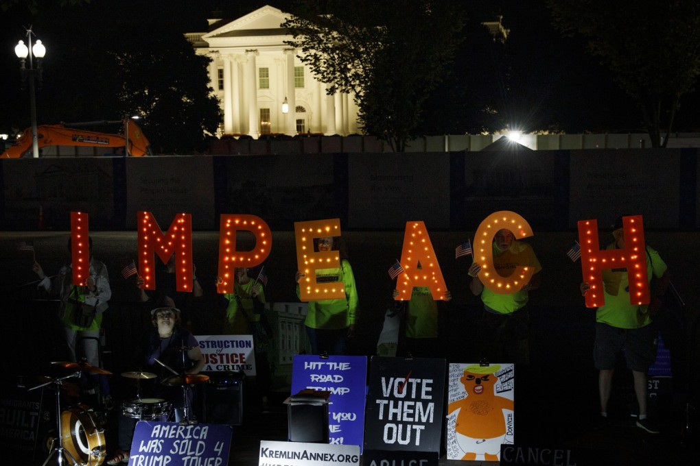 Protesters with “Kremlin Annex” call to impeach President Donald Trump in Lafayette Square Park in front of the White House in Washington, Tuesday, Sept. 24, 2019. House Speaker Nancy Pelosi of Calif., announced a formal impeachment inquiry into President Donald Trump. Photo: AP