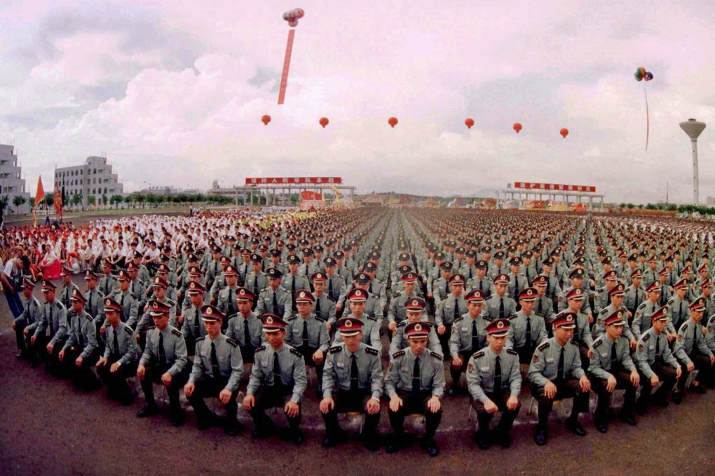 PLA soldiers attend a farewell ceremony on June 30, 1997, in Shenzhen, ahead of deployment to Hong Kong. Photo: Reuters