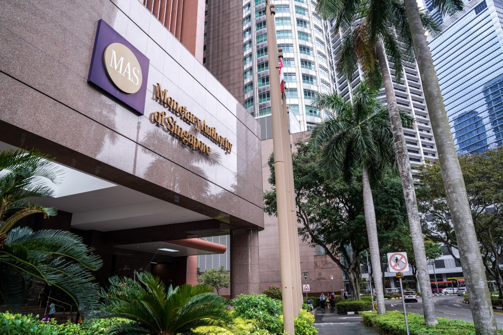 Signage for the Monetary Authority of Singapore is displayed outside the central bank's headquarters. Photo: Bloomberg