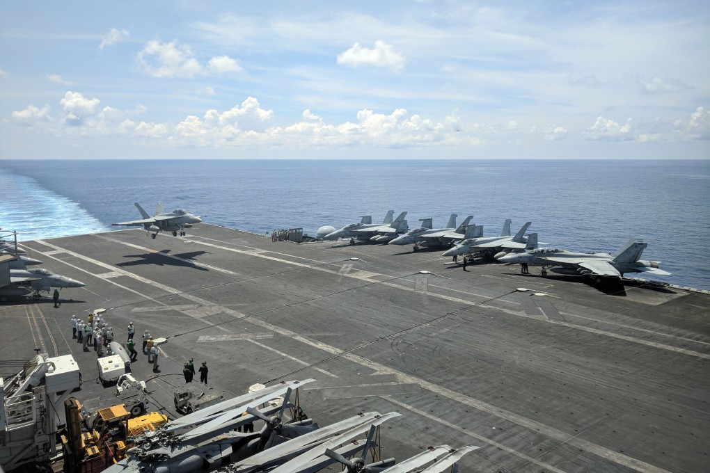 A US Navy F/A-18 Super Hornets multirole fighter lands on the flight deck of USS Ronald Reagan aircraft carrier as it sails the South China Sea on October 16. Photo: AFP