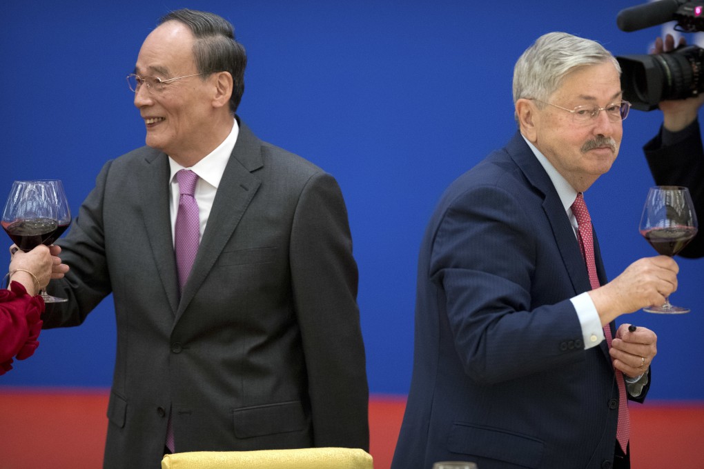 Chinese Vice President Wang Qishan, left, and US Ambassador to China Terry Branstad toast at an event commemorating the 40th anniversary of the establishment of diplomatic relations between the United States and China in January. Beijing has protested new Washington requirements about diplomats’ visits in the US. Photo: AP