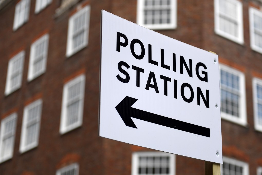 A sign points to a polling station in London in May 2018. Photo: EPA-EFE