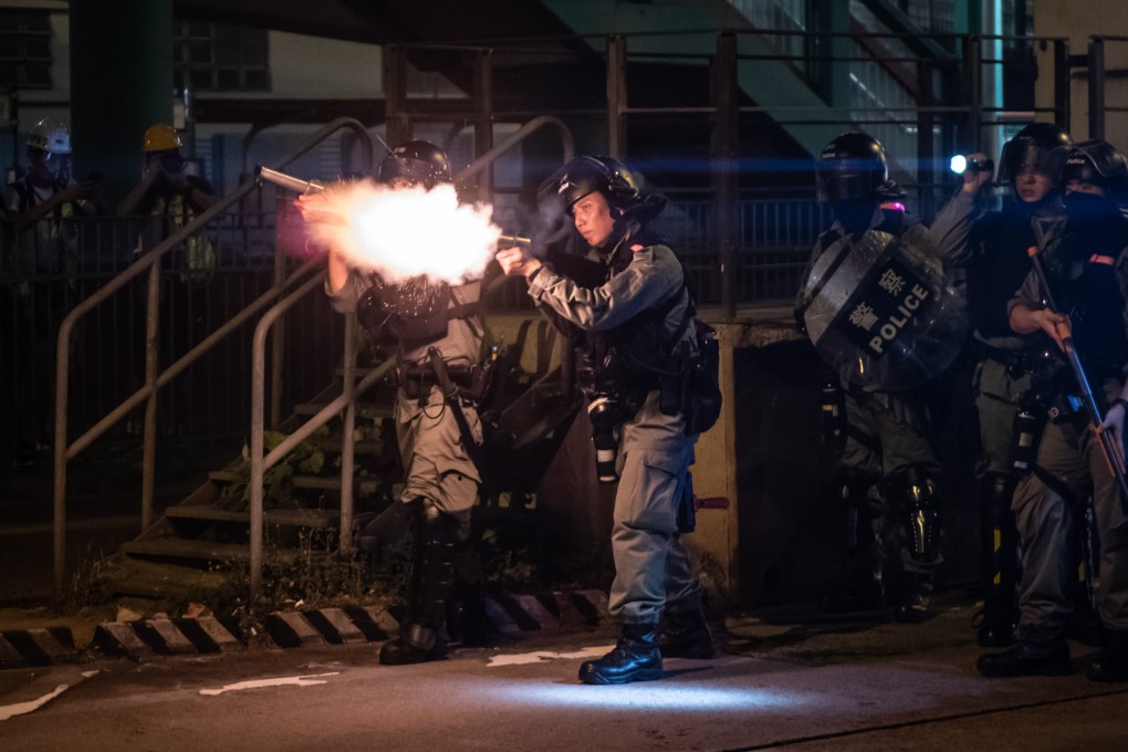 Riot police fire tear gas during pro-democracy demonstrators in Hong Kong on October 21. Photo: AFP