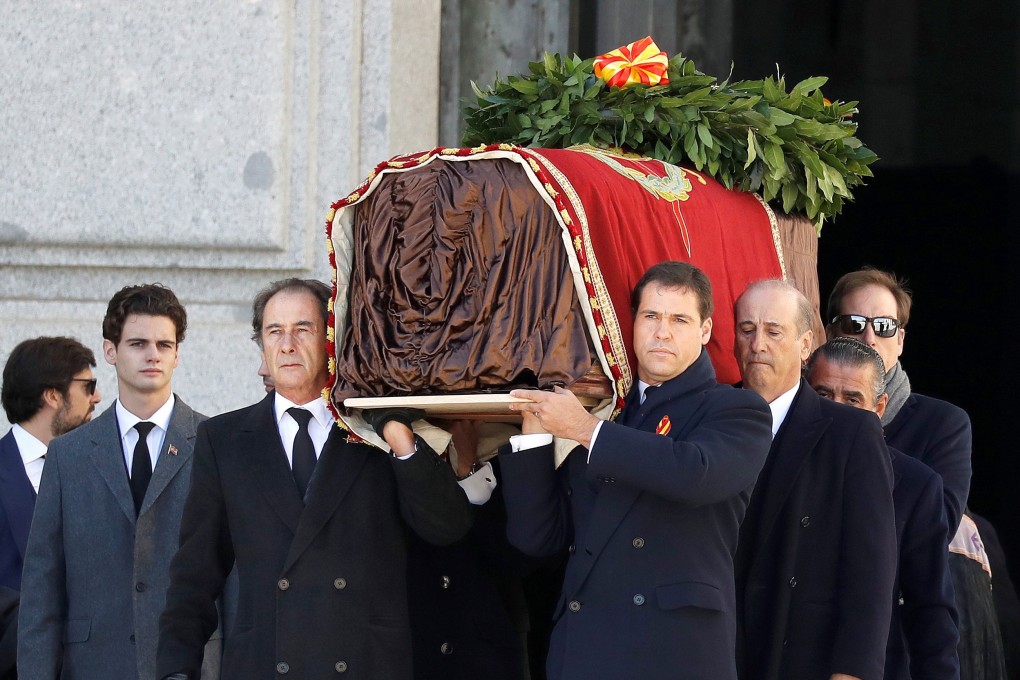 Relatives of former Spanish dictator Francisco Franco carry his coffin after his exhumation. Photo: EPA-EFE